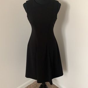 Black sheath style dress with pleats